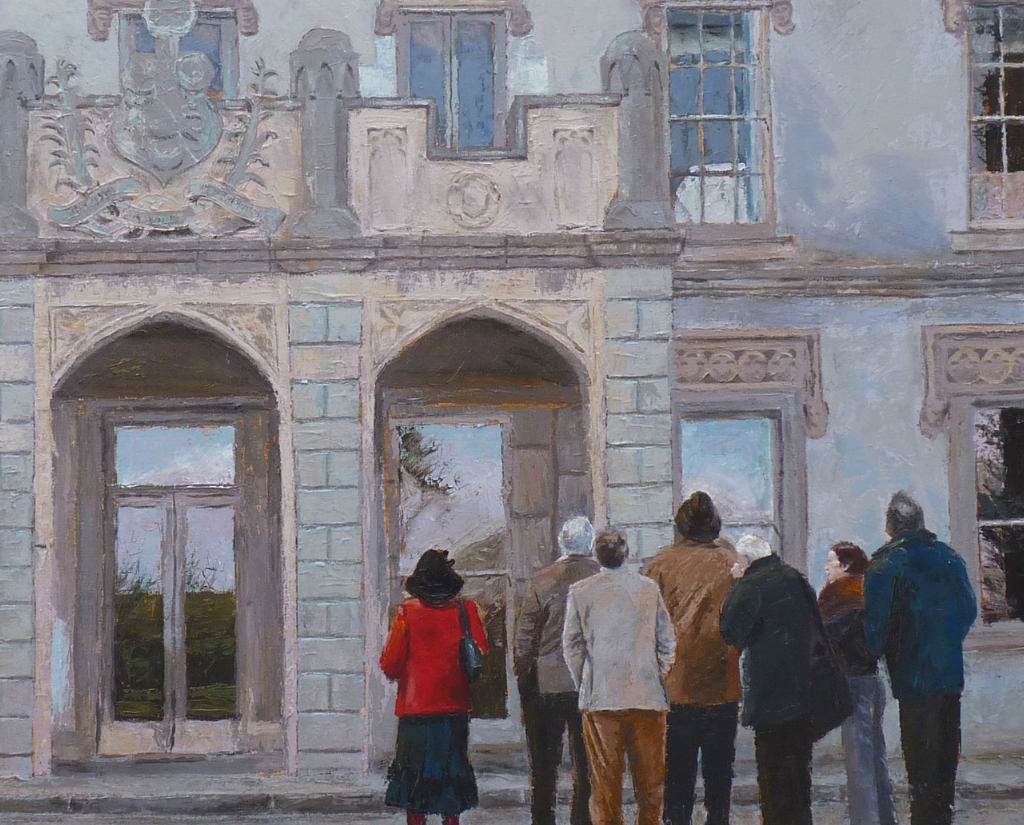 A group of people looking at a building. Their backs are to the viewer.