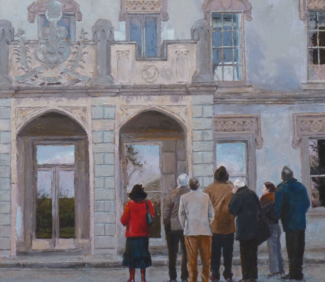 A group of people looking at a building. Their backs are to the viewer.