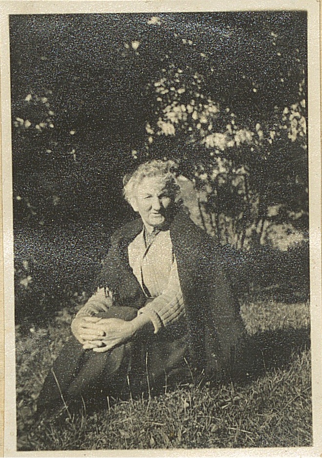 Photograph of Anastasia Buckley seated on grass.