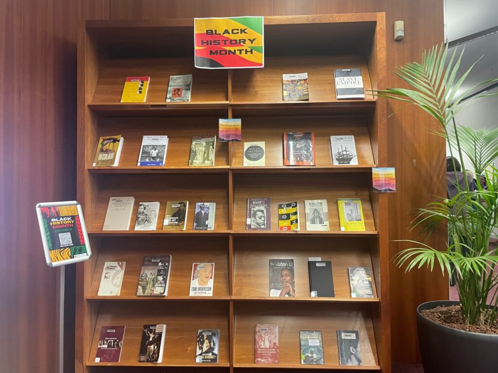 Bookcase with various books on it for black history month.