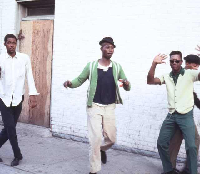 Five men dancing and skipping. Detroit 1968. Color photograph by Alen MacWeeney.