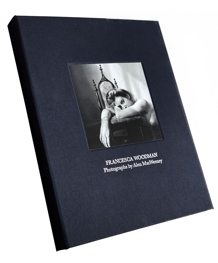 Portfolio box/slip case with blue bookcloth and portrait of Francesca Woodman on cover.