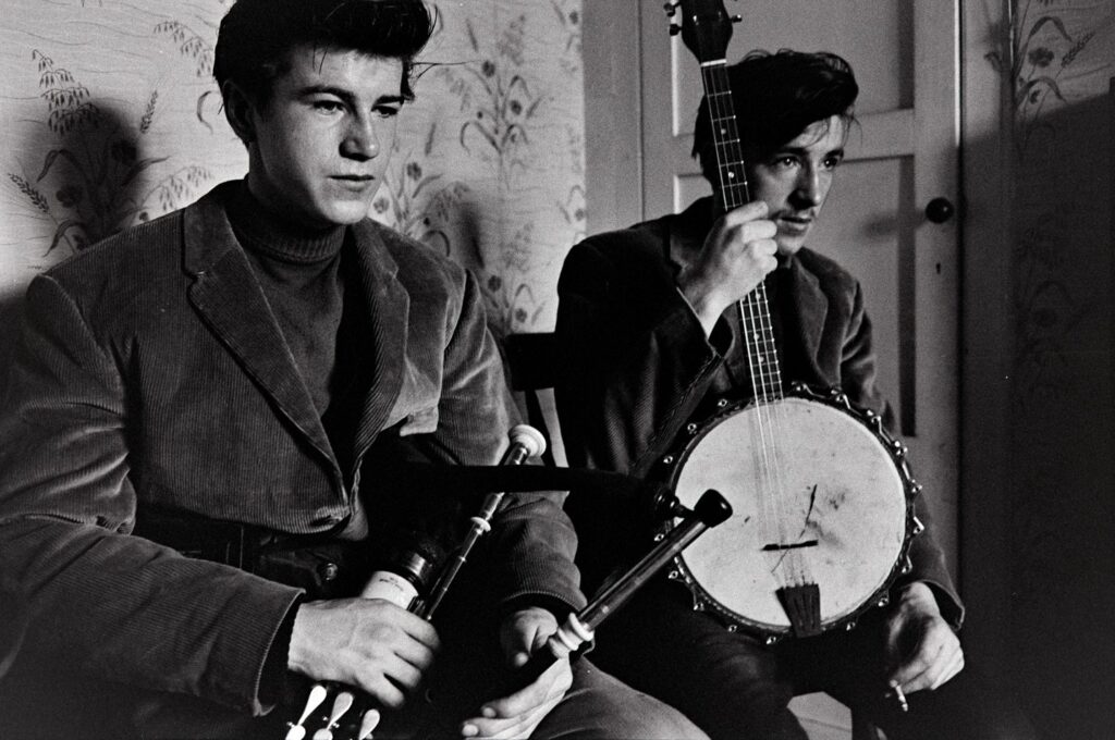 Black and white photo by Aen MacWeeney of two Irish musicians.