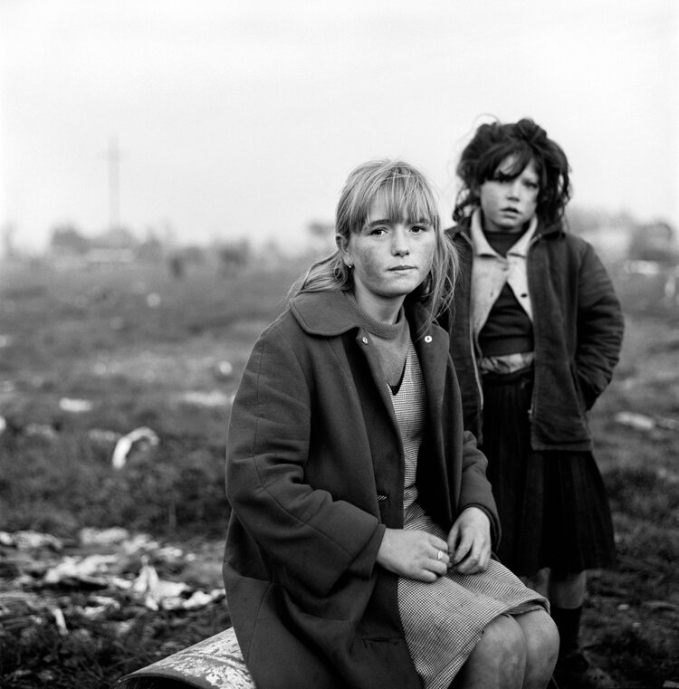 Black and white photo by Alen MacWeeney of two girls.