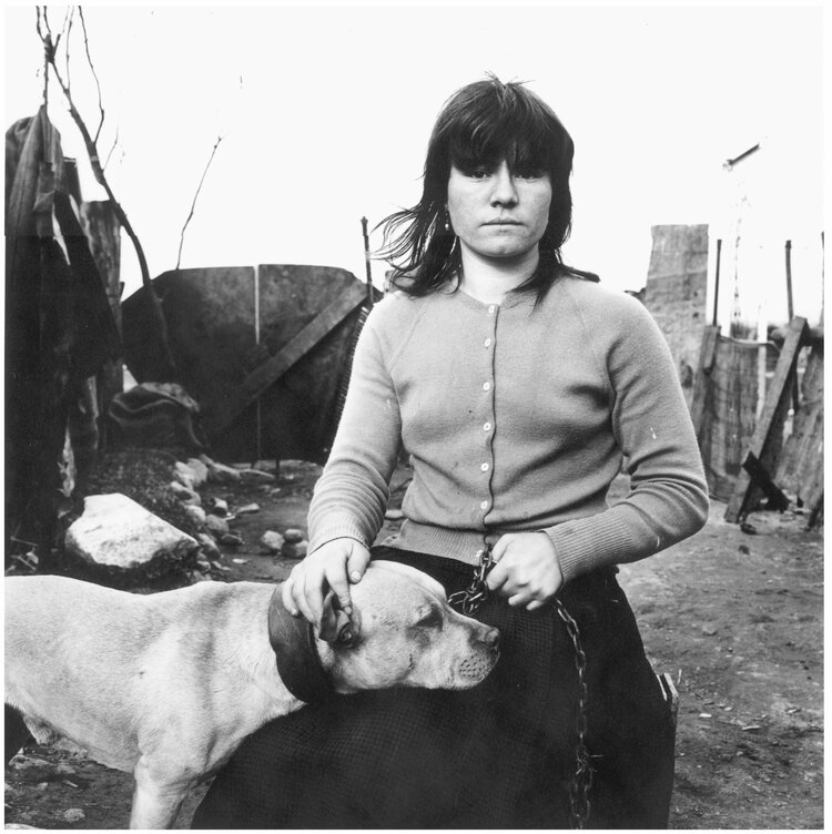 Black and white photo by Alen MacWeeney of woman with dog.