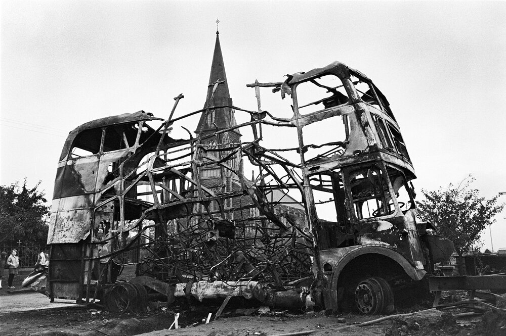 Burnt out bus after bombing.