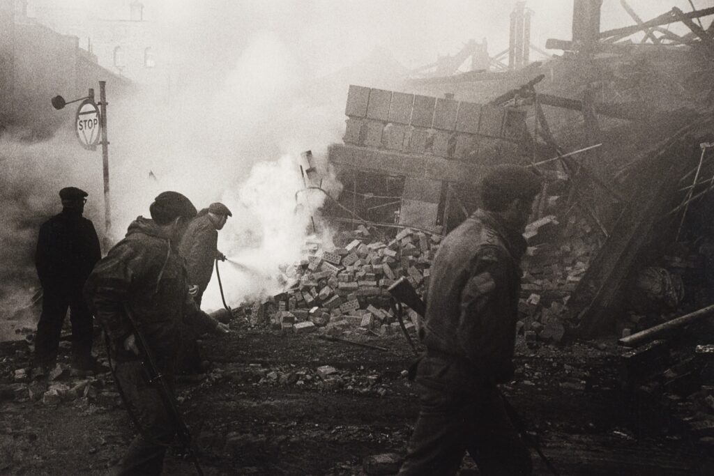 Firefighters putting out fire after bombing.