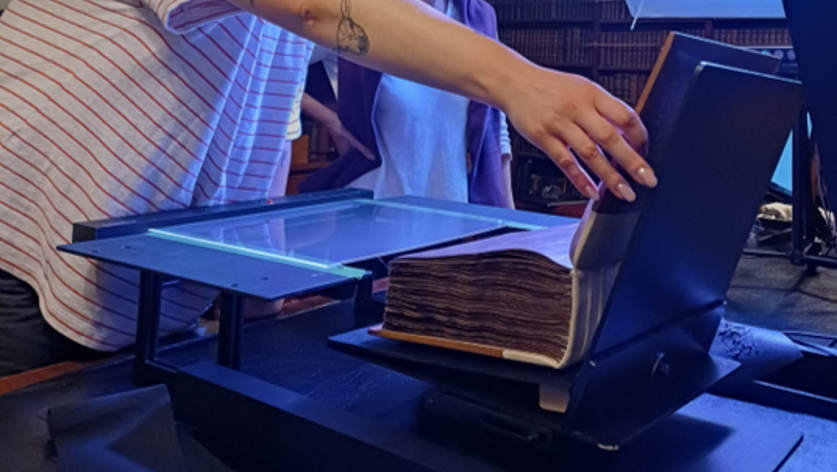 Examining a bound manuscript using the camera imaging setup.